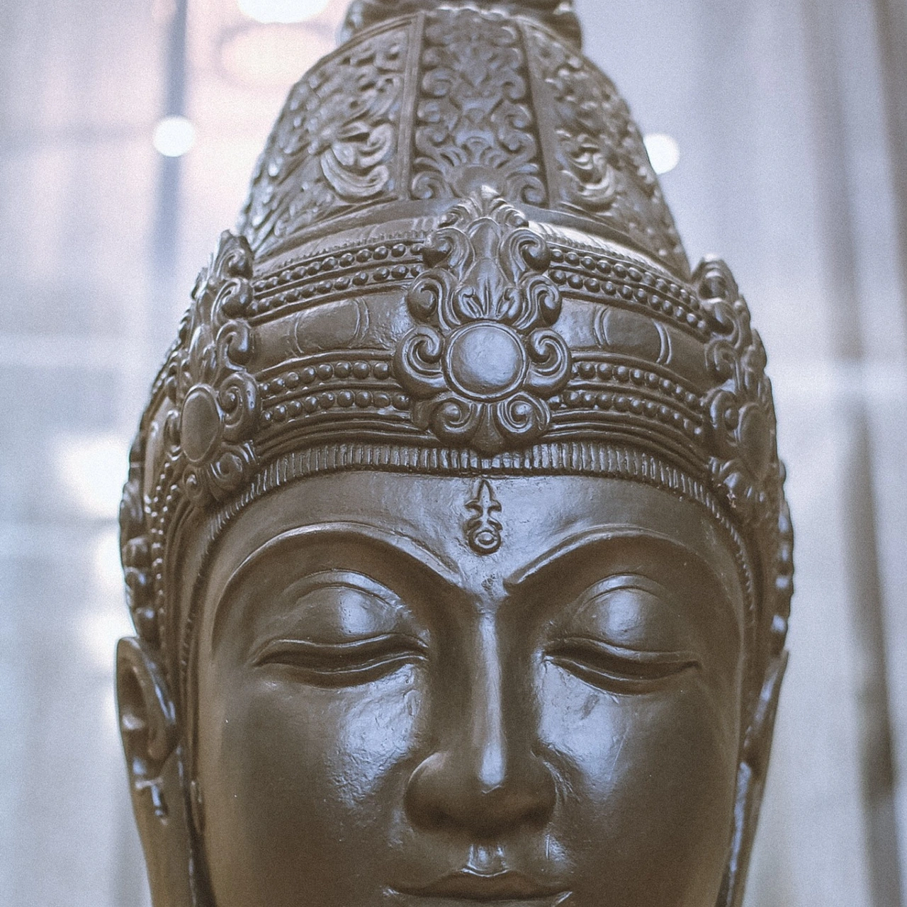 Carved Balinese bust with an intricate headdress